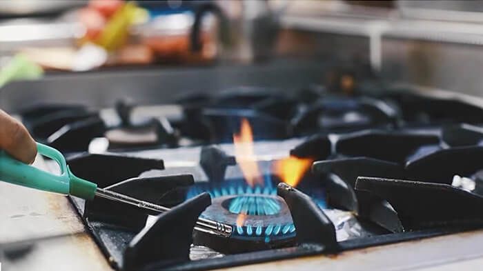 Lighting a natural gas stove