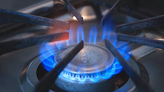 Closeup of burner on natural gas stove - Pixabay
